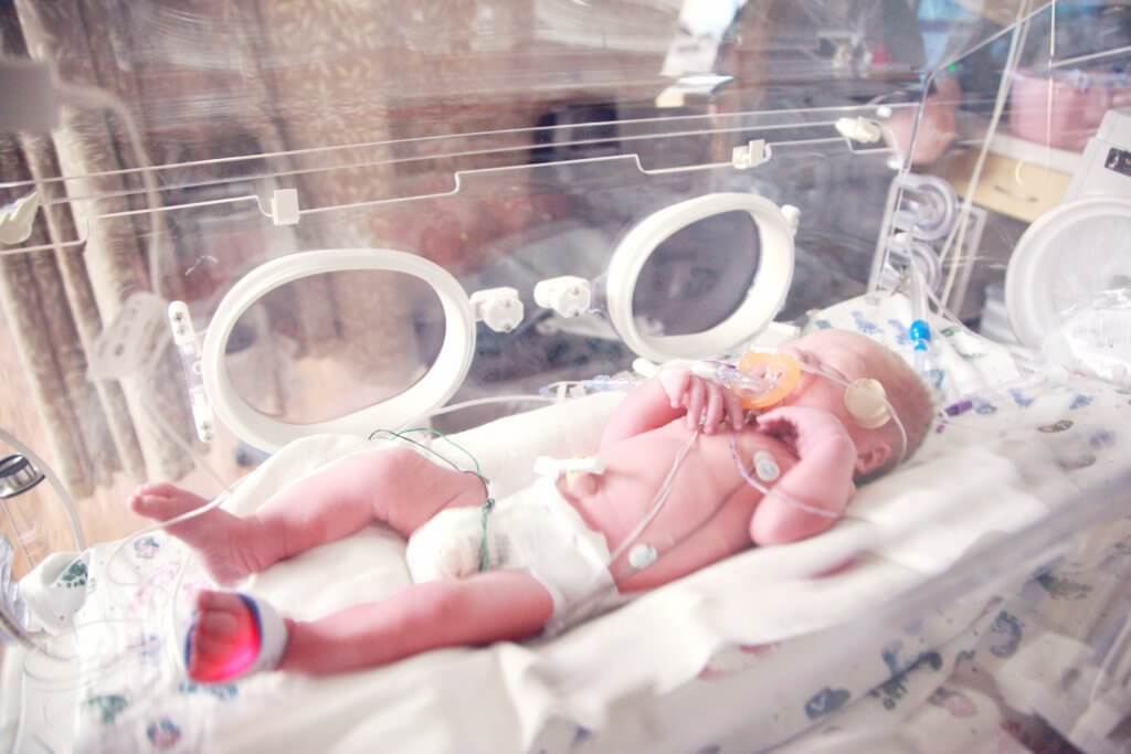 Premature baby in incubator