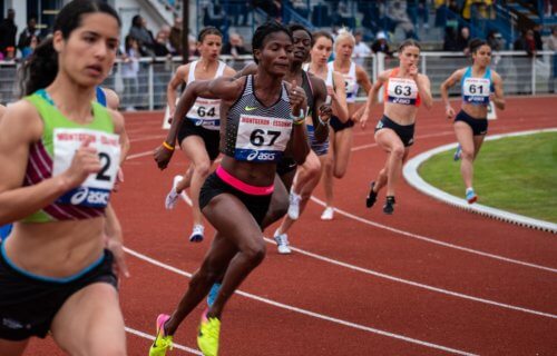 Women running in track and field race