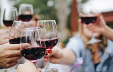 People toasting glasses of red wine