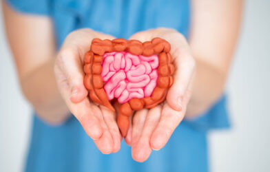 Gut health: Woman holds intestines model in hands